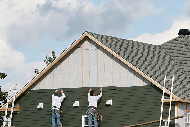 Professional Storm Damage Siding Repair technician working in Schwenksville, PA